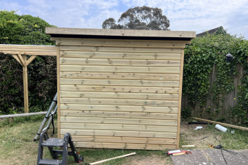 Cladding the first front wall