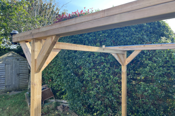 Revised cross beam positioned lower to support roof automation