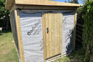 Door finished with cladding and a lock